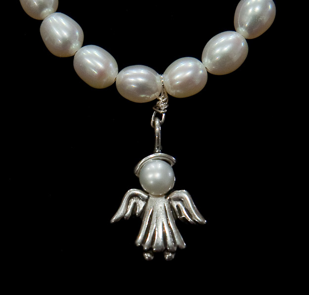 Silver angel with pearl face on pearls $46   on chain  $38