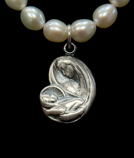 Madonna and child on pearls $46   on chain  $36