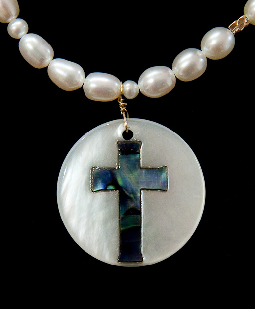 Pearl bracelet with mother of pearl disk with cross    $32